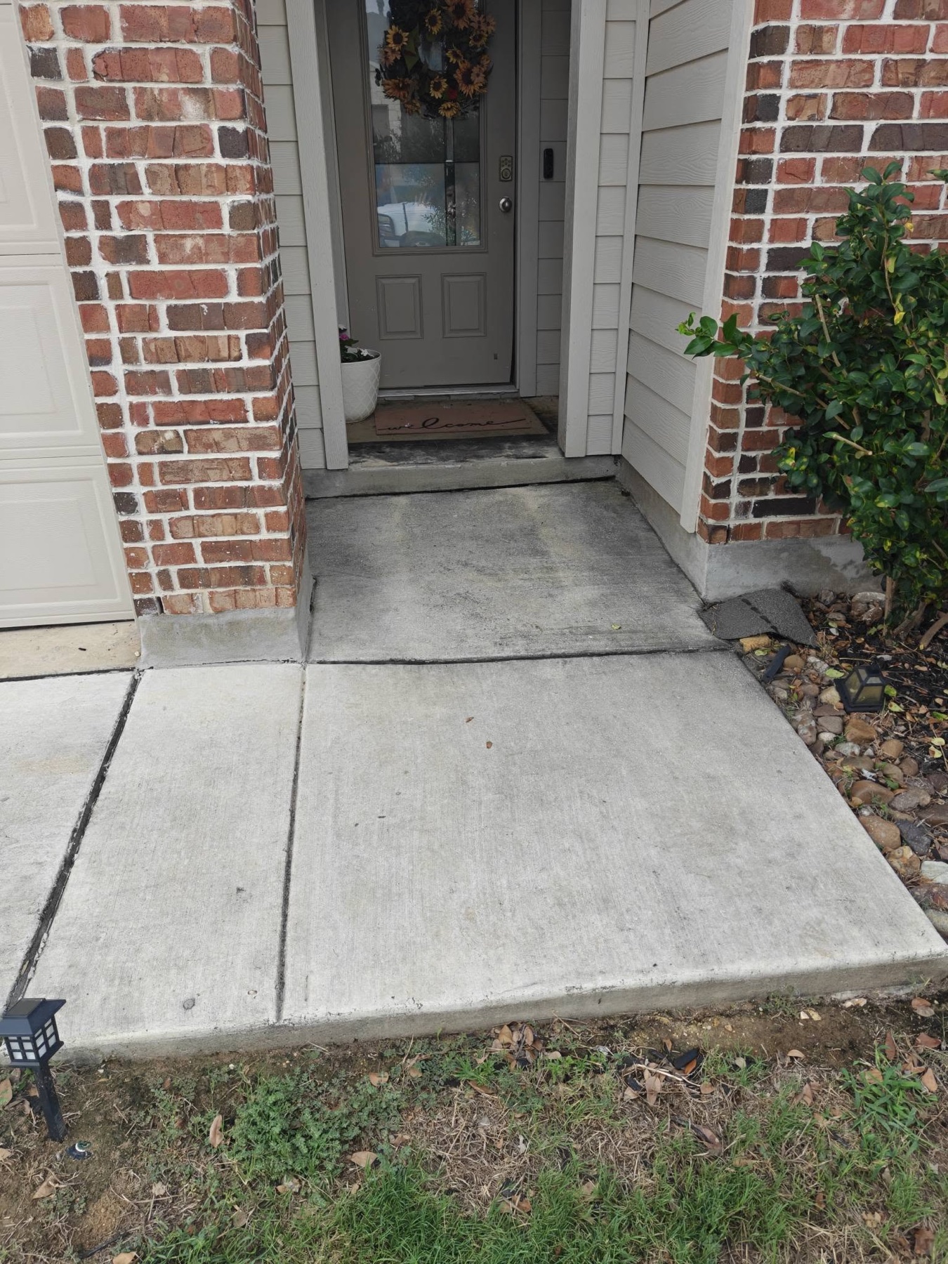 Front entry concrete before Titan Wash cleaning